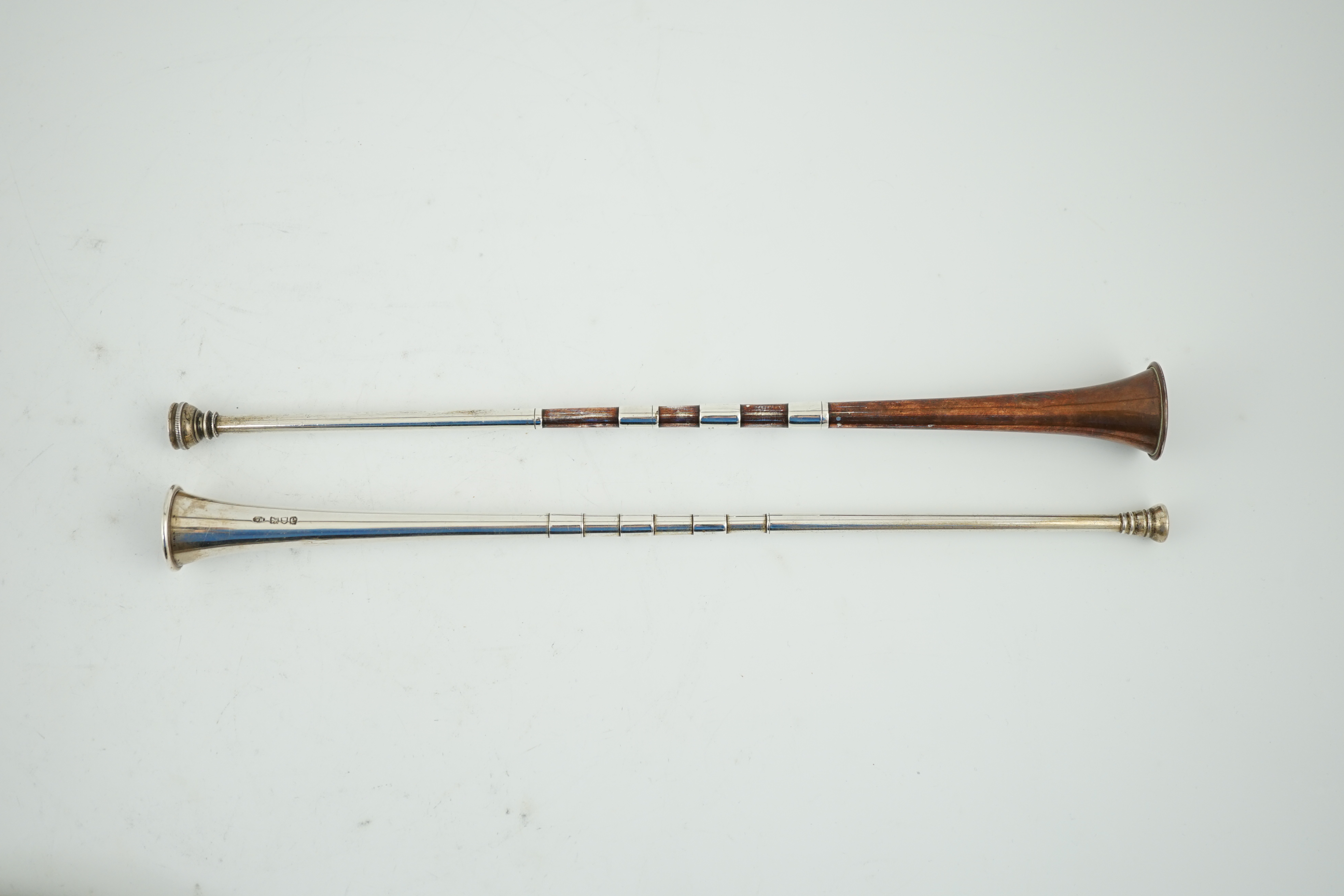 A late Victorian silver hunting horn, by William Hornby, London, 1900, together with a George V silver hunting horn, with coppered banding